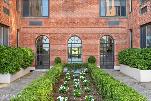 a view of a chair and tables in the garden