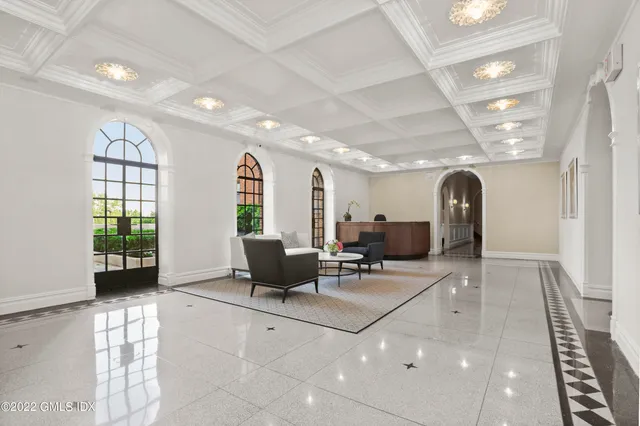 a view of a patio with table and chairs and potted plants