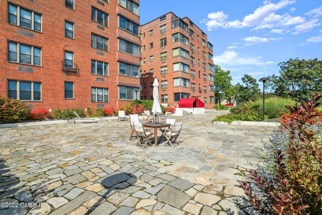 a front view of a building with garden