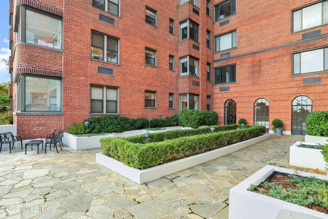 a front view of a house with yard