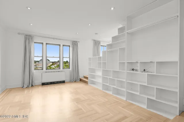 a view of kitchen with refrigerator and an sink