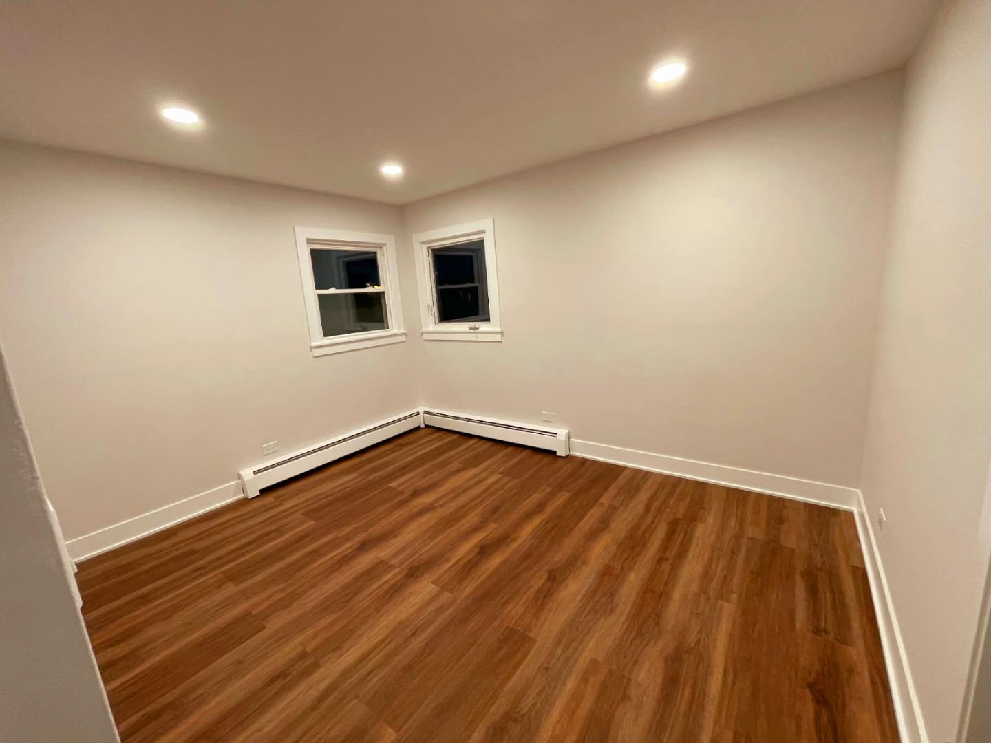 8228 West Walsh Lane, Unit 3F River Grove, IL 60171 - Photo 14 of 20 a view of an empty room with wooden floor and a window