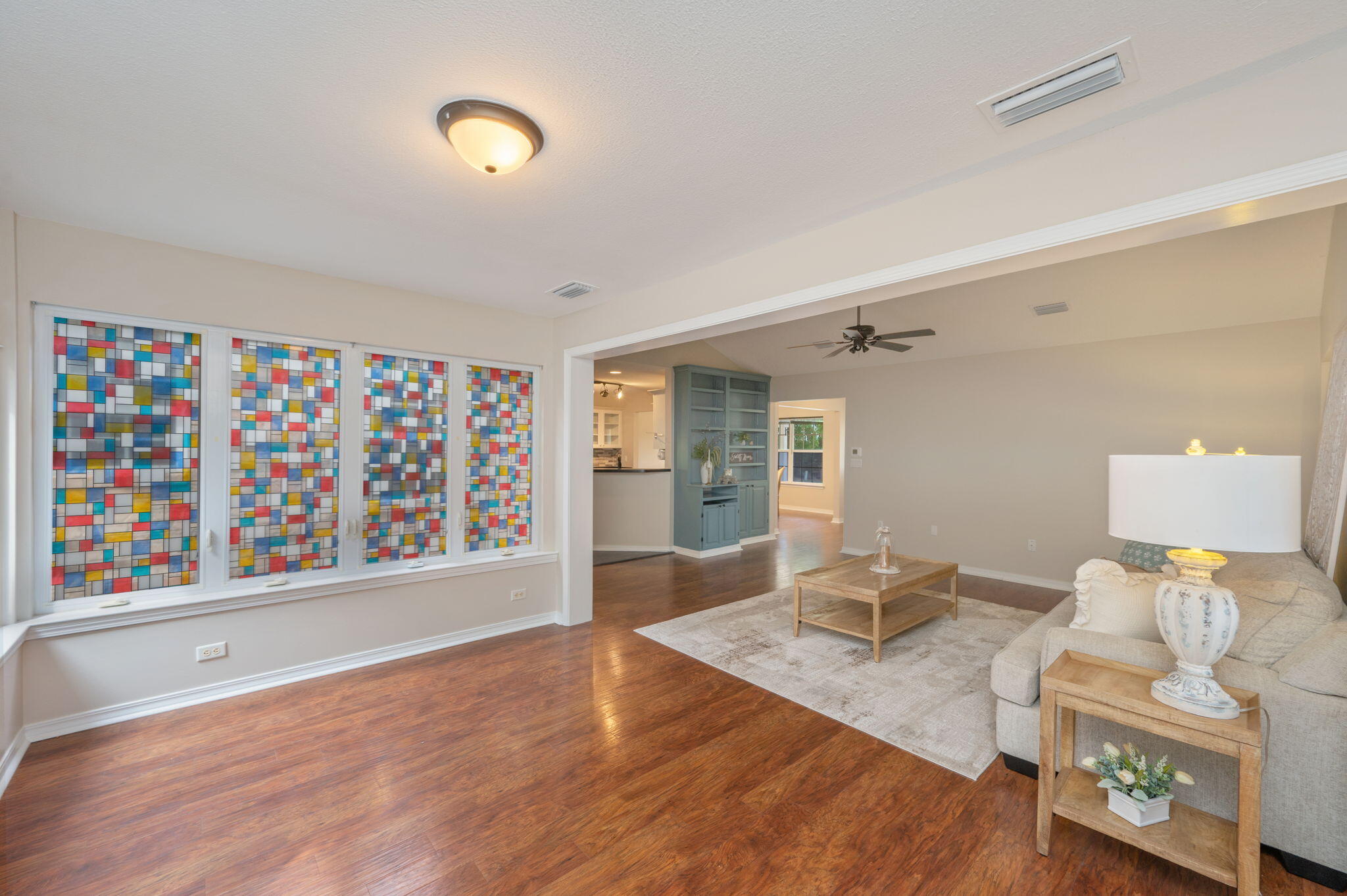 109 Eagle Drive Crestview, FL 32536 - Photo 14 of 52 a view of an empty room with wooden floor and a window