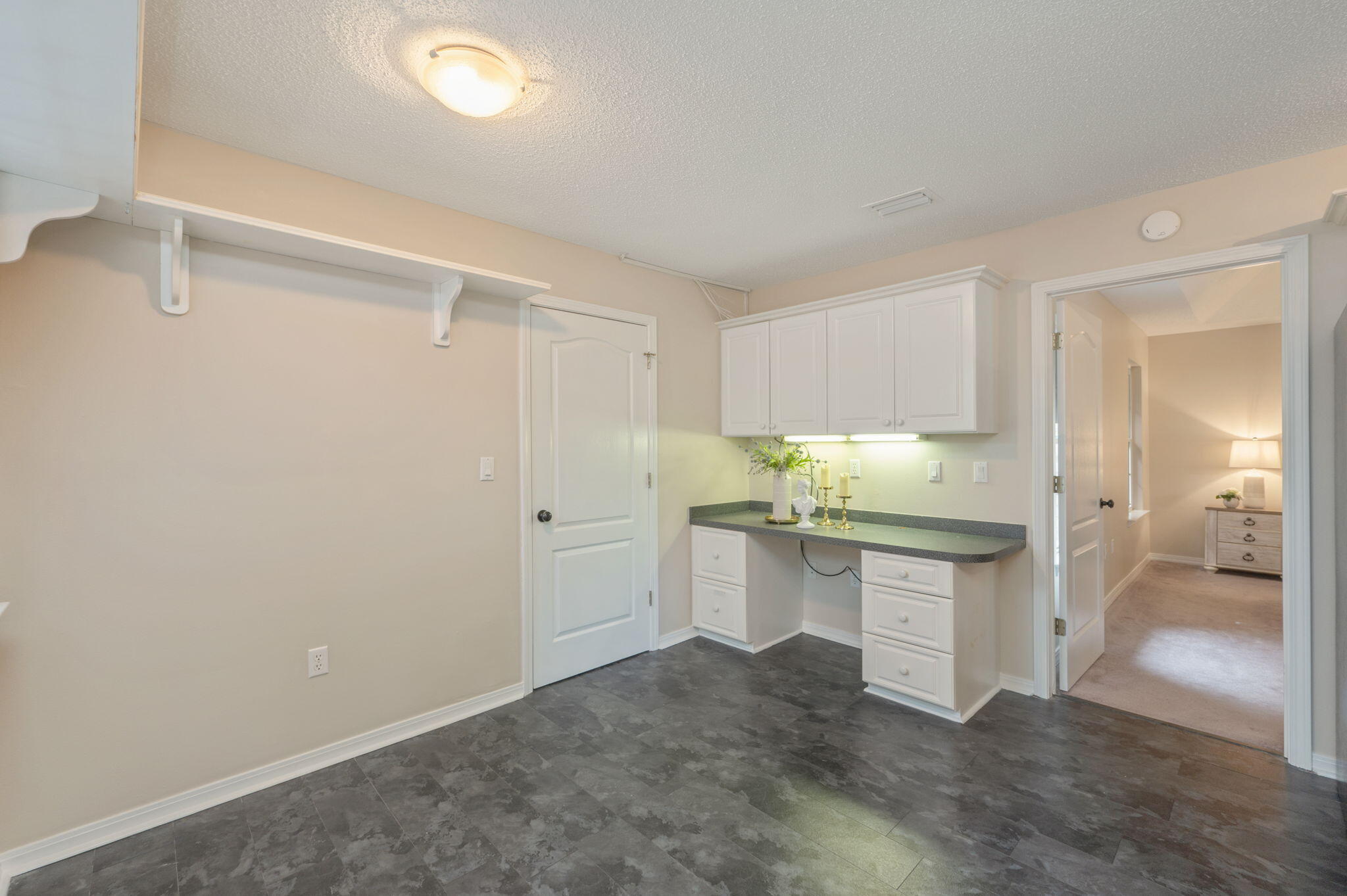 109 Eagle Drive Crestview, FL 32536 - Photo 15 of 52 a room with white cabinets and sink