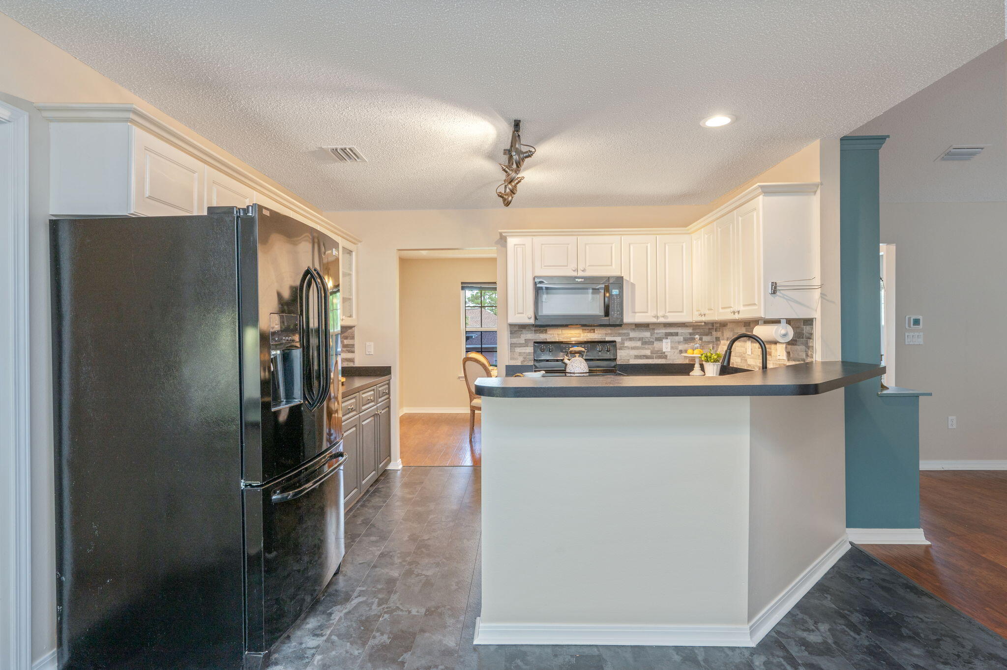 109 Eagle Drive Crestview, FL 32536 - Photo 16 of 52 a kitchen with stainless steel appliances granite countertop a refrigerator a stove and a sink