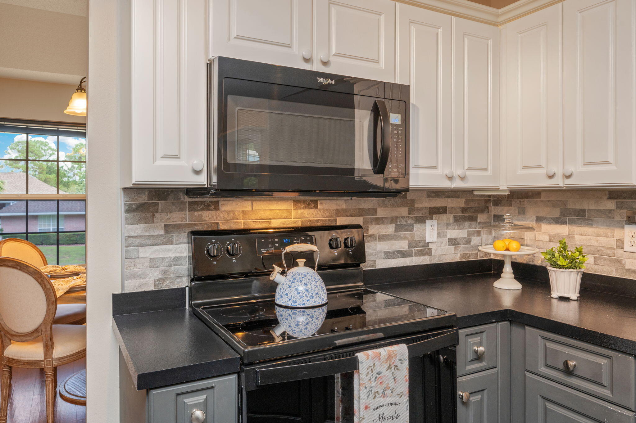 109 Eagle Drive Crestview, FL 32536 - Photo 21 of 52 a kitchen with a stove and cabinets