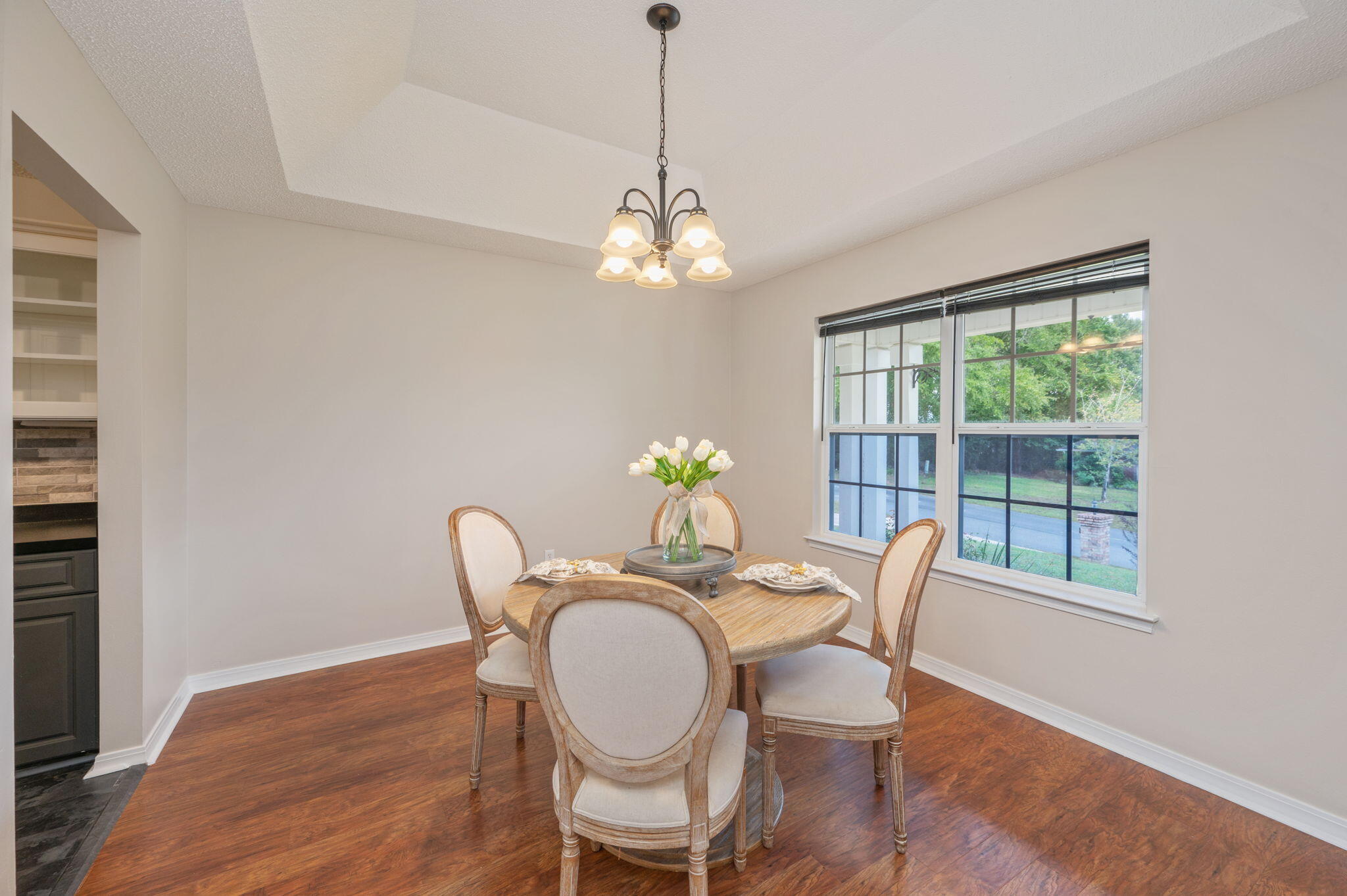 109 Eagle Drive Crestview, FL 32536 - Photo 22 of 52 a dining room with furniture a chandelier and wooden floor