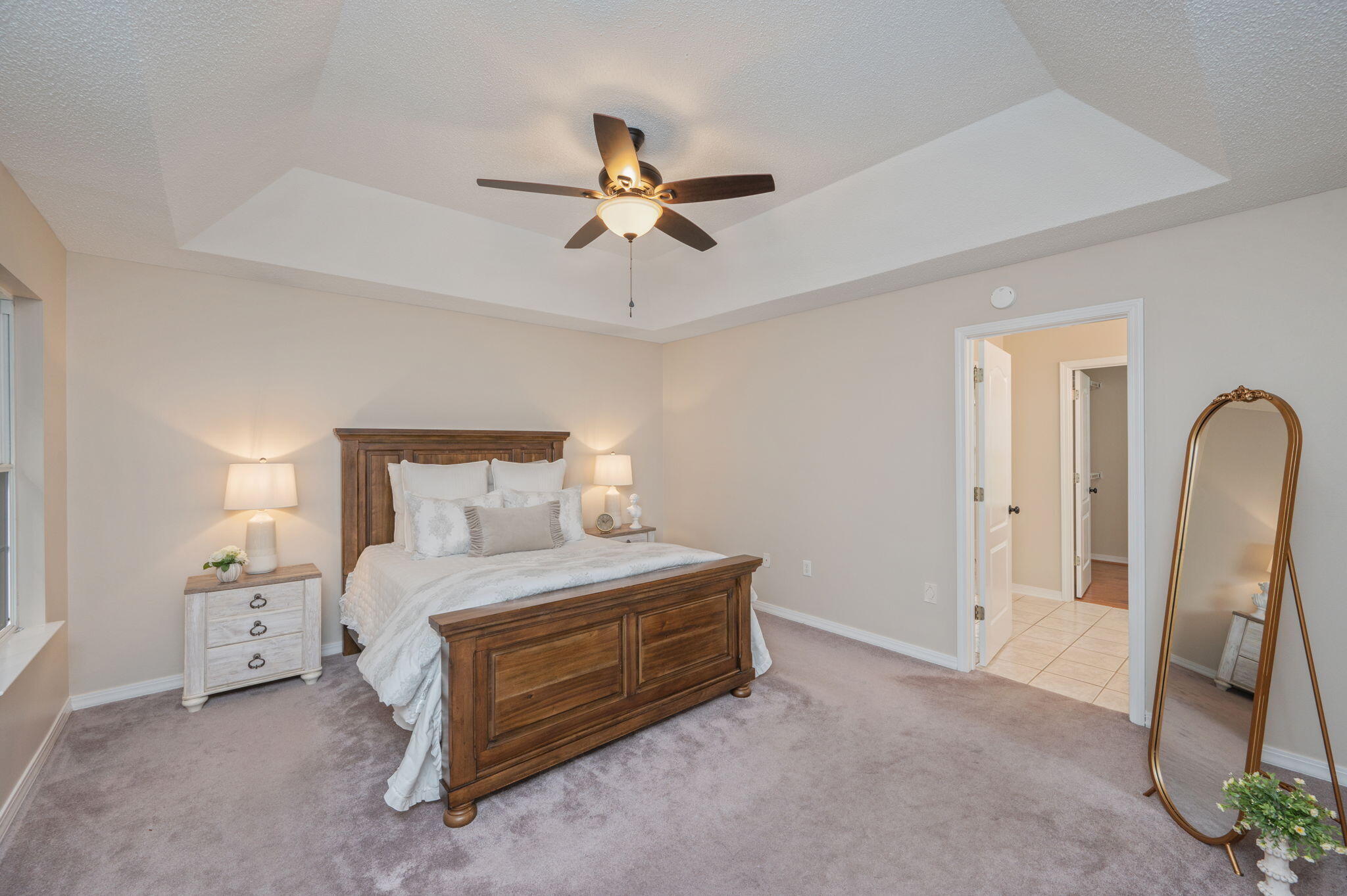 109 Eagle Drive Crestview, FL 32536 - Photo 23 of 52 a bedroom with a bed and a chandelier