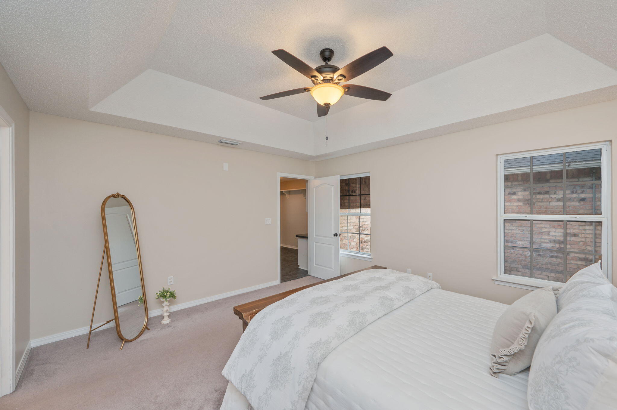 109 Eagle Drive Crestview, FL 32536 - Photo 25 of 52 a bedroom with a bed and a chandelier