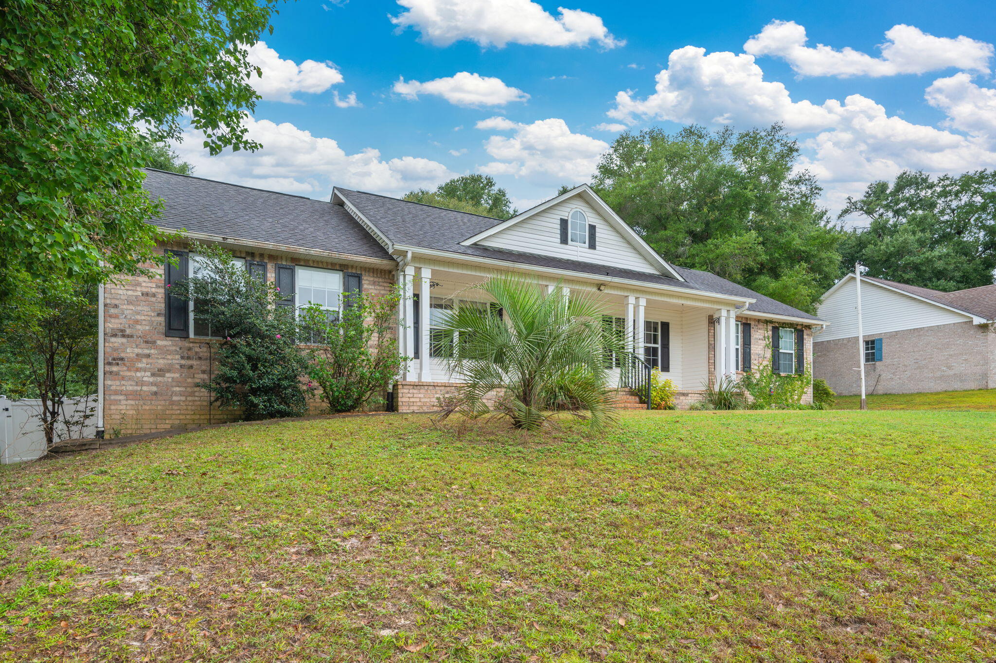 109 Eagle Drive Crestview, FL 32536 - Photo 3 of 52 a view of a house with a yard and potted plants
