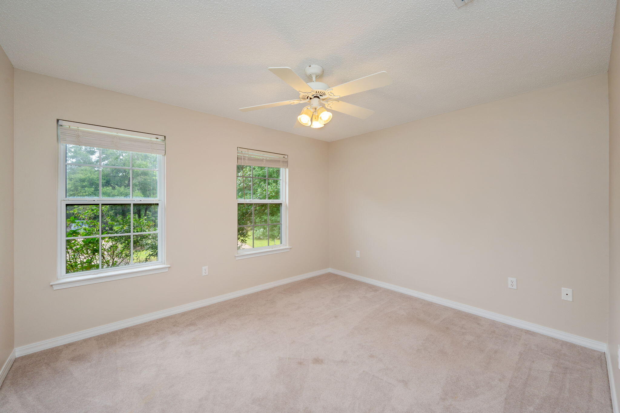 109 Eagle Drive Crestview, FL 32536 - Photo 34 of 52 an empty room with a window and a fan