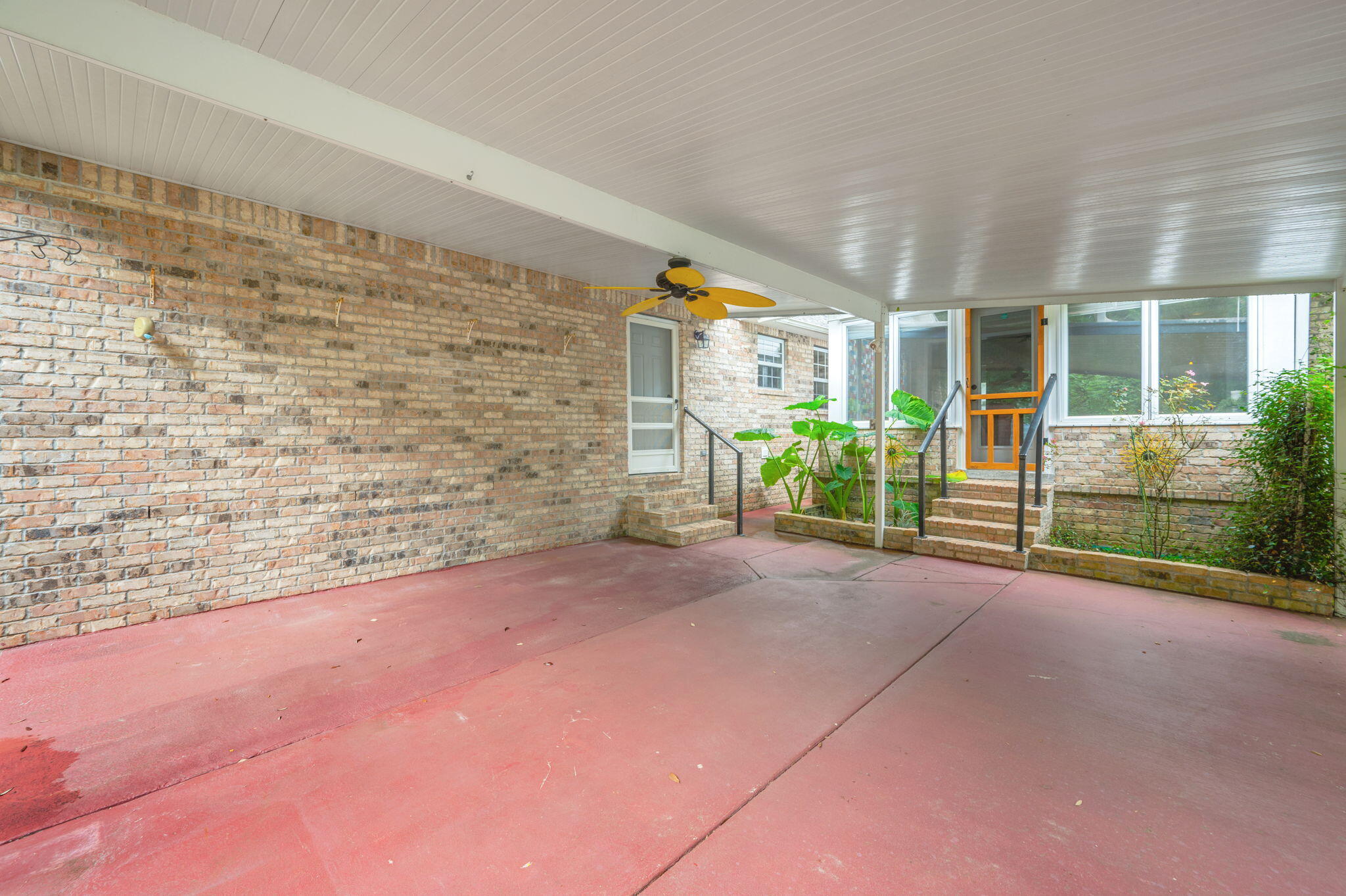 109 Eagle Drive Crestview, FL 32536 - Photo 44 of 52 a view of a house with porch and garden