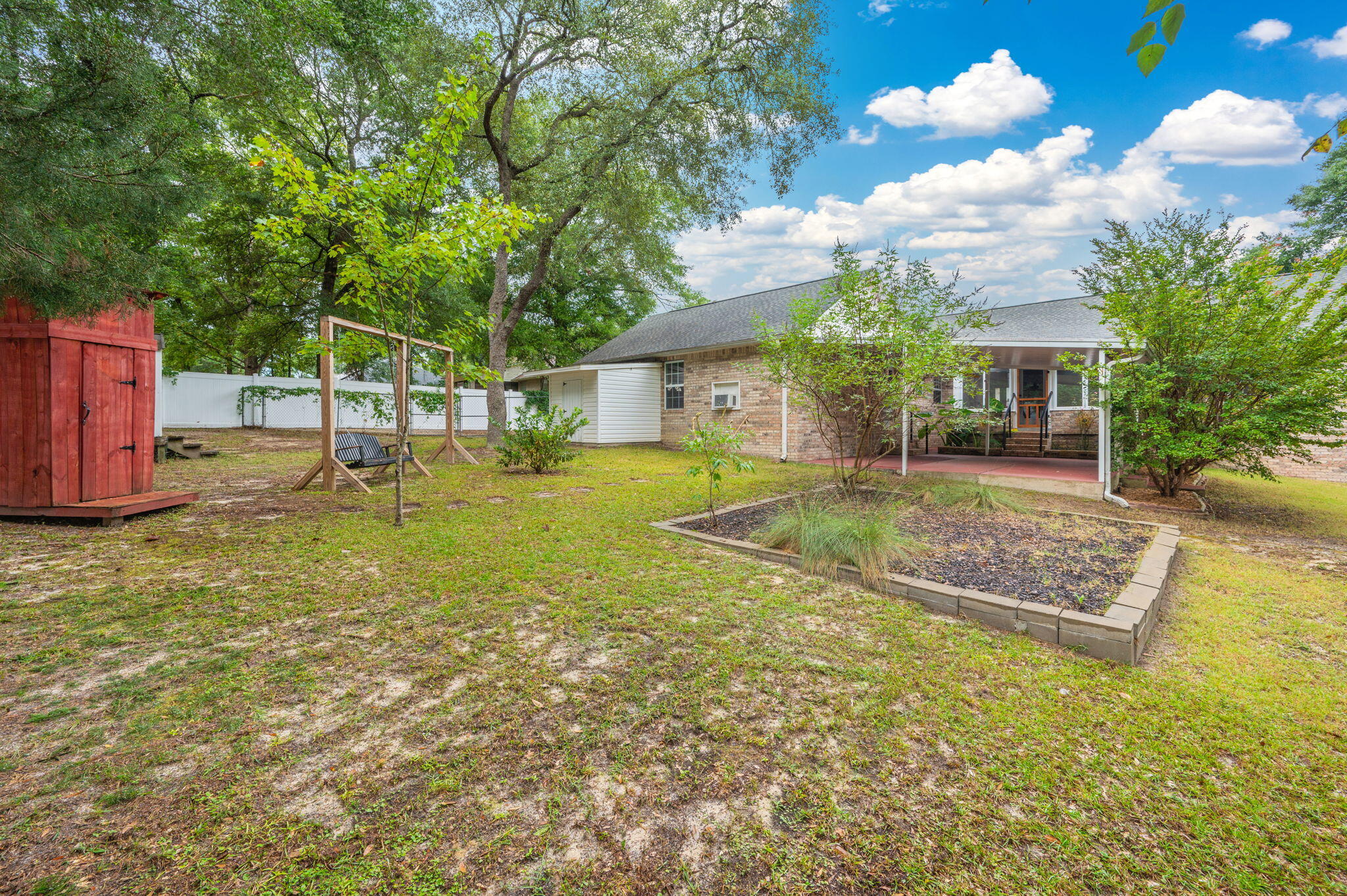 109 Eagle Drive Crestview, FL 32536 - Photo 49 of 52 a view of a house with a yard porch and sitting area