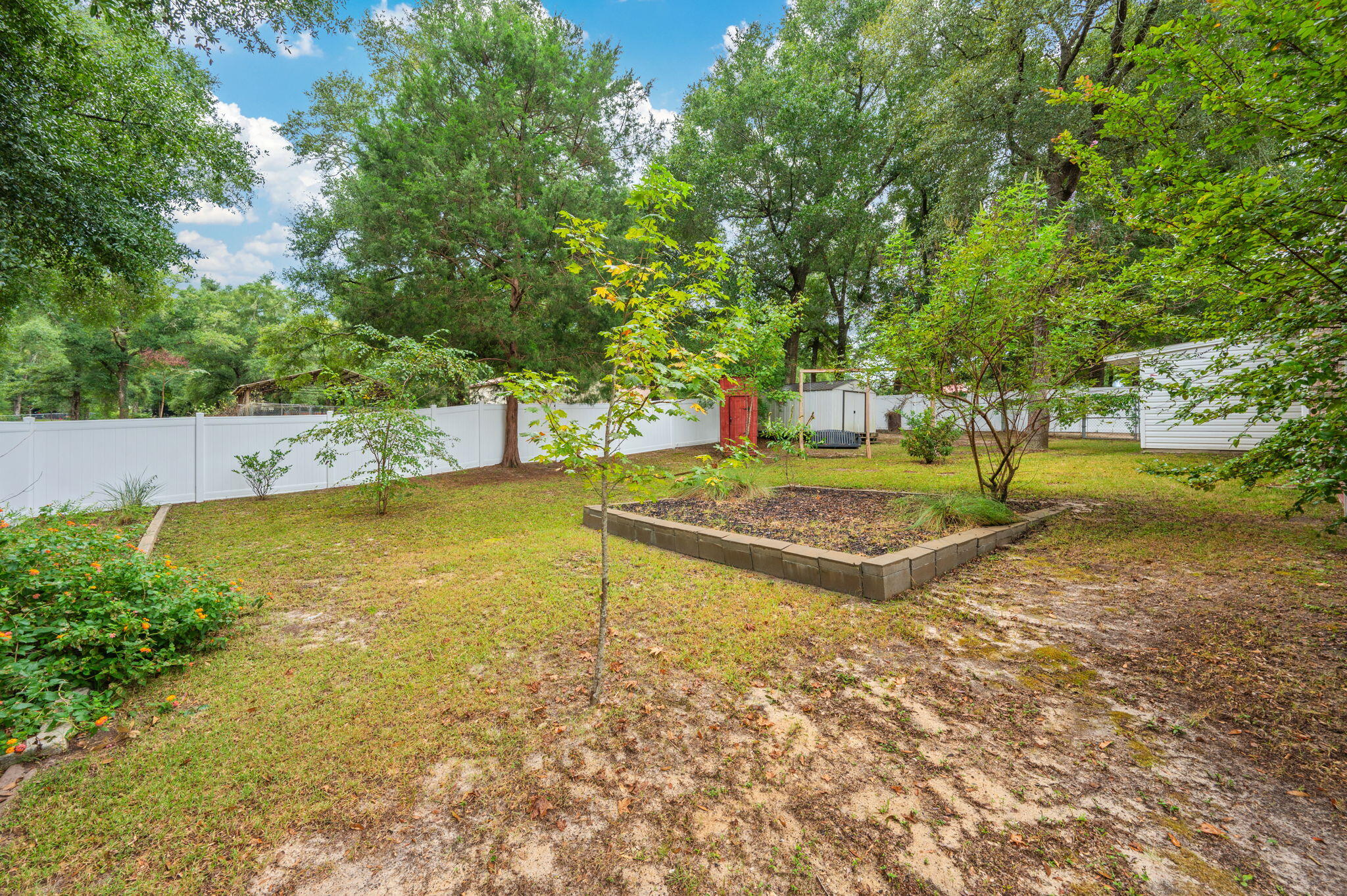 109 Eagle Drive Crestview, FL 32536 - Photo 51 of 52 a view of a yard with swimming pool