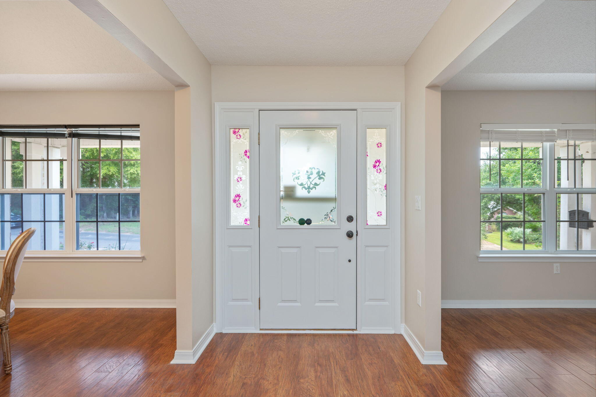 109 Eagle Drive Crestview, FL 32536 - Photo 8 of 52 wooden floor in an empty room with a window