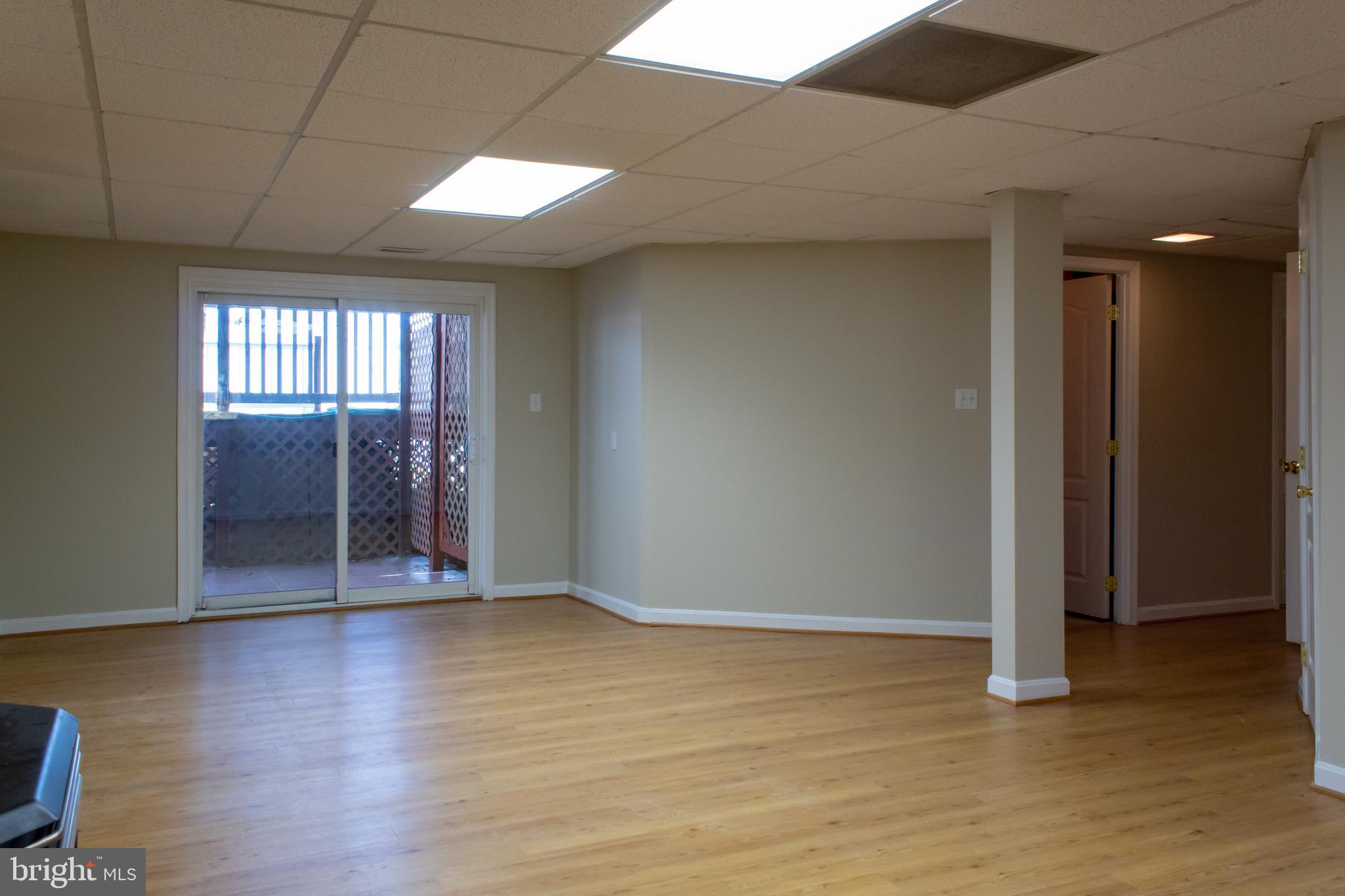144 Windcliff Road Prince Frederick, MD 20678 - Photo 24 of 47 Rec Room Slider Entrance to Back of House
