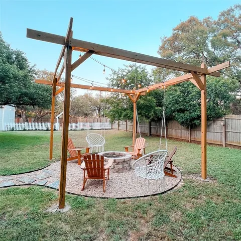 a view of a backyard with sitting area and roof