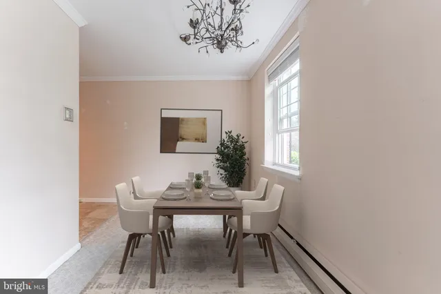 a view of a dining room with furniture and window