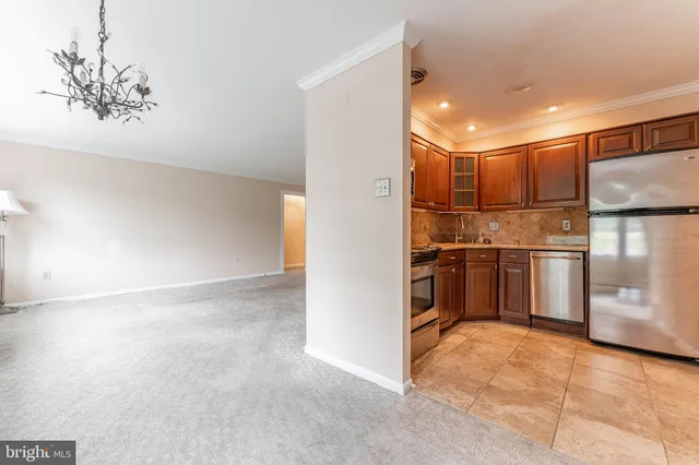a kitchen with a refrigerator sink and microwave