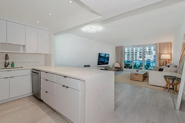 a kitchen with cabinets and a couch