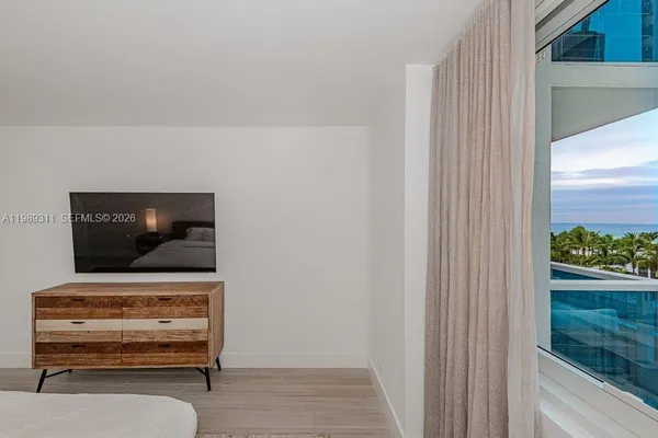 a living room with furniture and flat screen tv