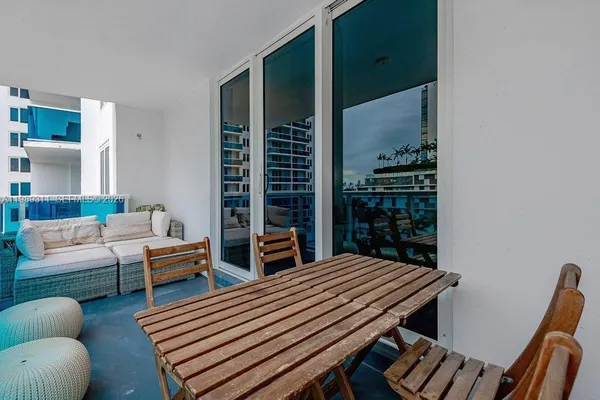 a bedroom with furniture and wooden floor