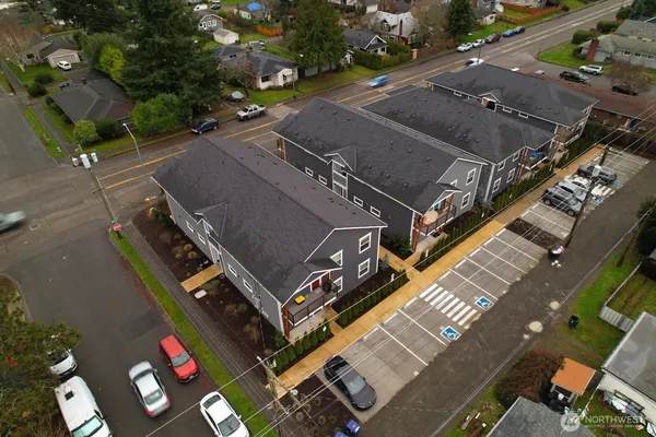 an aerial view of a house with a yard