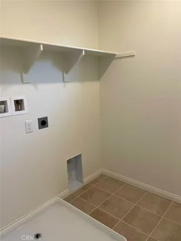 a view of a room with shelf on the wall