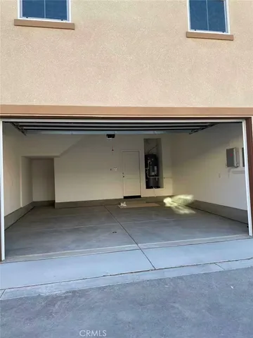 a room with a stove and large window