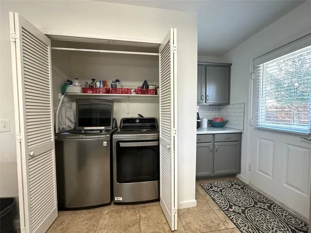 a kitchen with a stove and a refrigerator