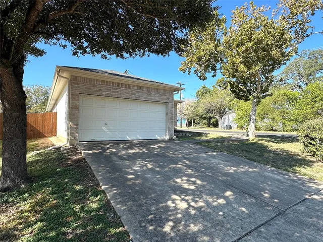 a view of a house with a tree