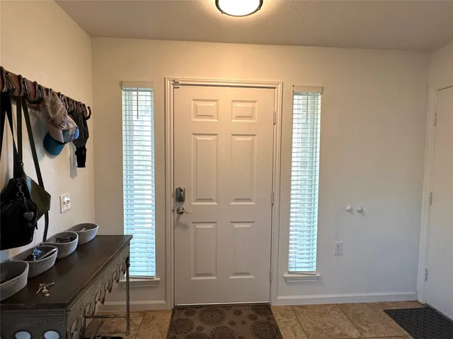 an entryway with a workspace