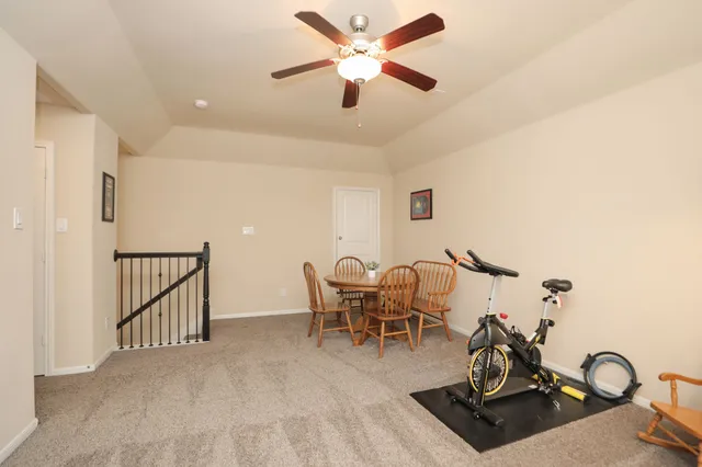 a view of a livingroom with furniture and flat screen tv