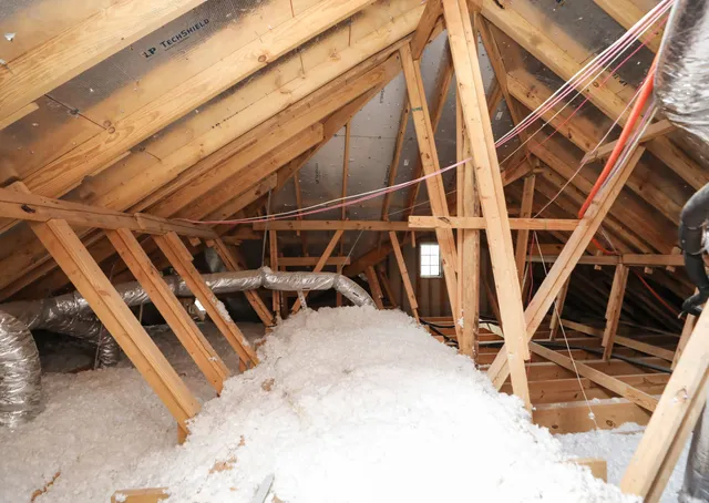 a view of a patio with chairs and umbrellas on a sidewalk