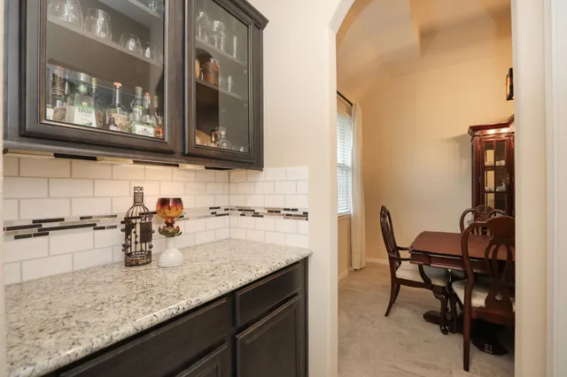 a large kitchen with kitchen island a sink stainless steel appliances and cabinets