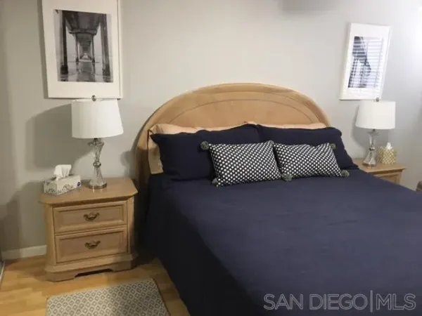 a bedroom with a bed and dresser