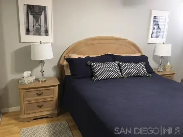 a bedroom with a bed and dresser