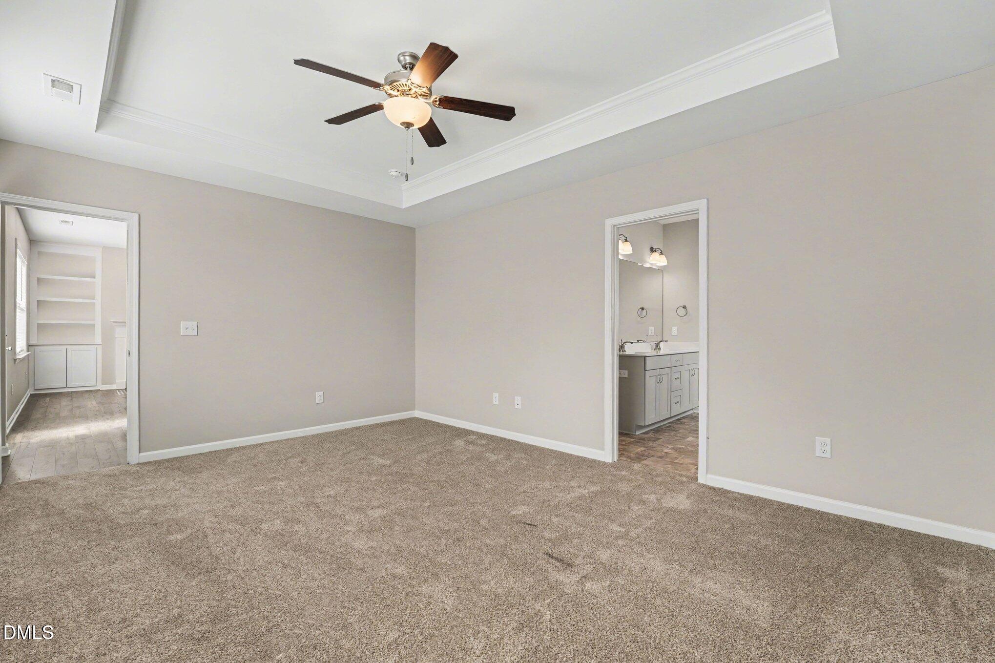 106 Two Daughters Streme Smithfield, NC 27577 - Photo 14 of 25 a view of an empty room and a ceiling fan