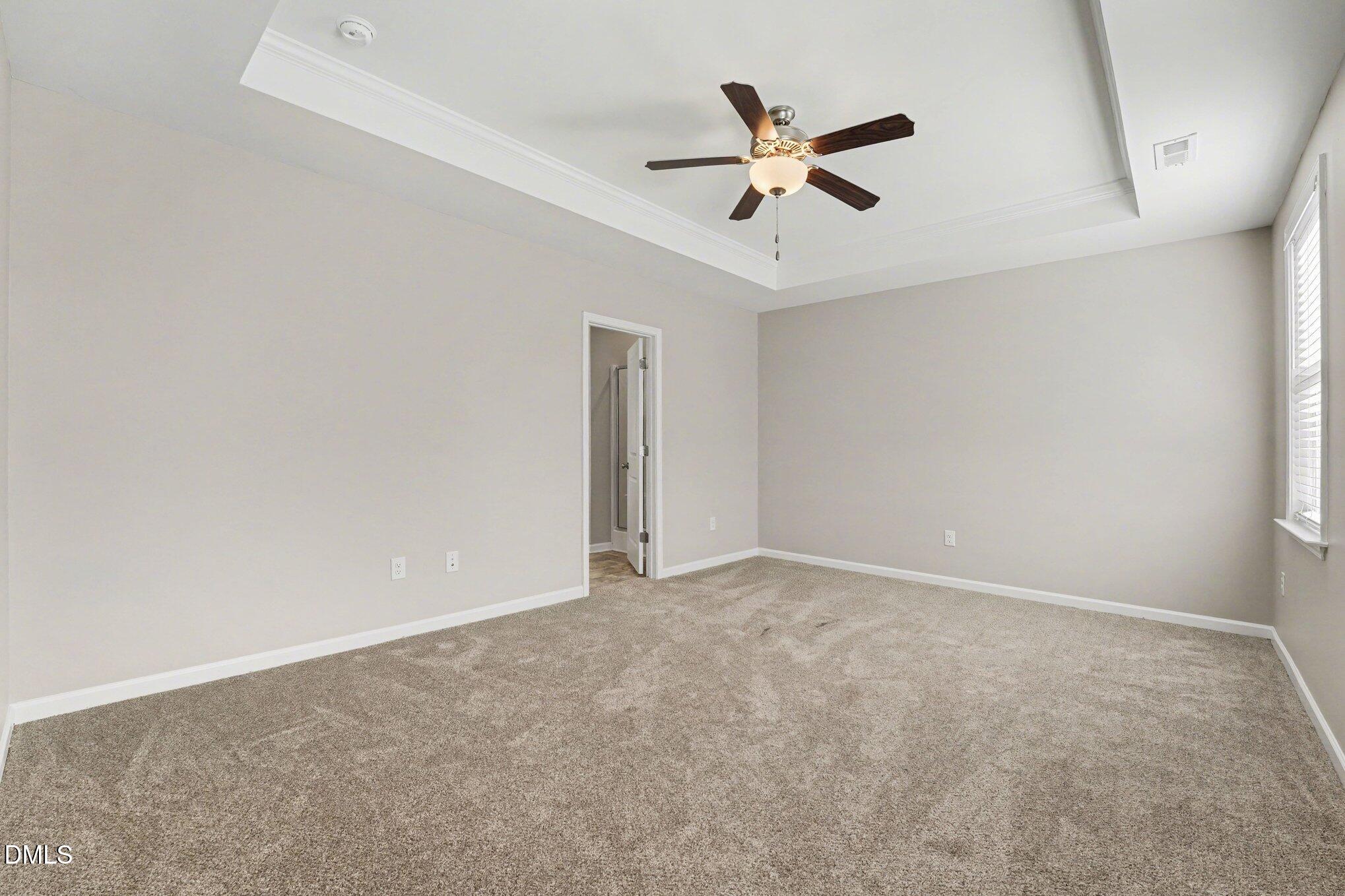 106 Two Daughters Streme Smithfield, NC 27577 - Photo 15 of 25 an empty room with closet and ceiling fan
