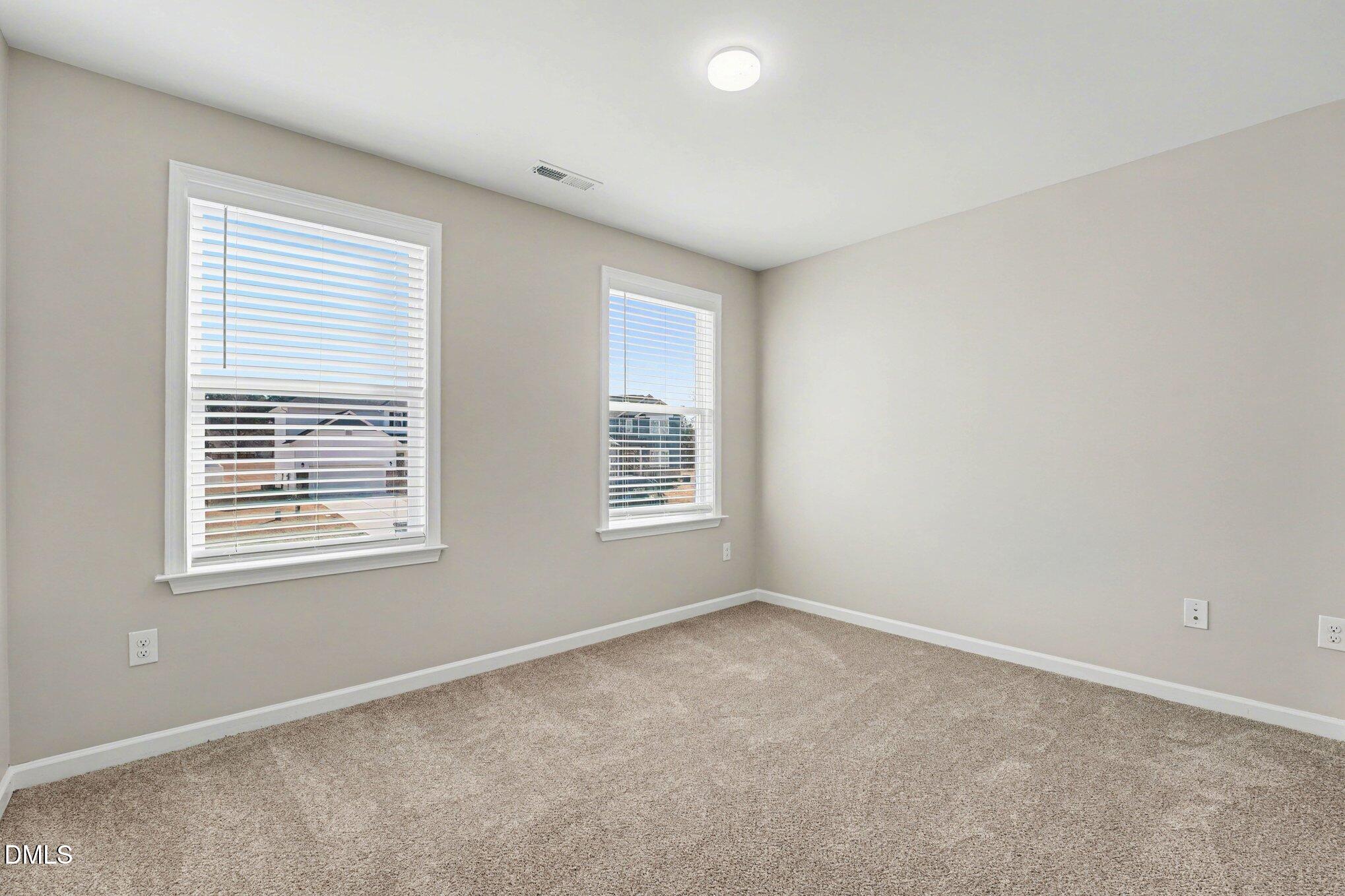 106 Two Daughters Streme Smithfield, NC 27577 - Photo 17 of 25 a view of an empty room with a window