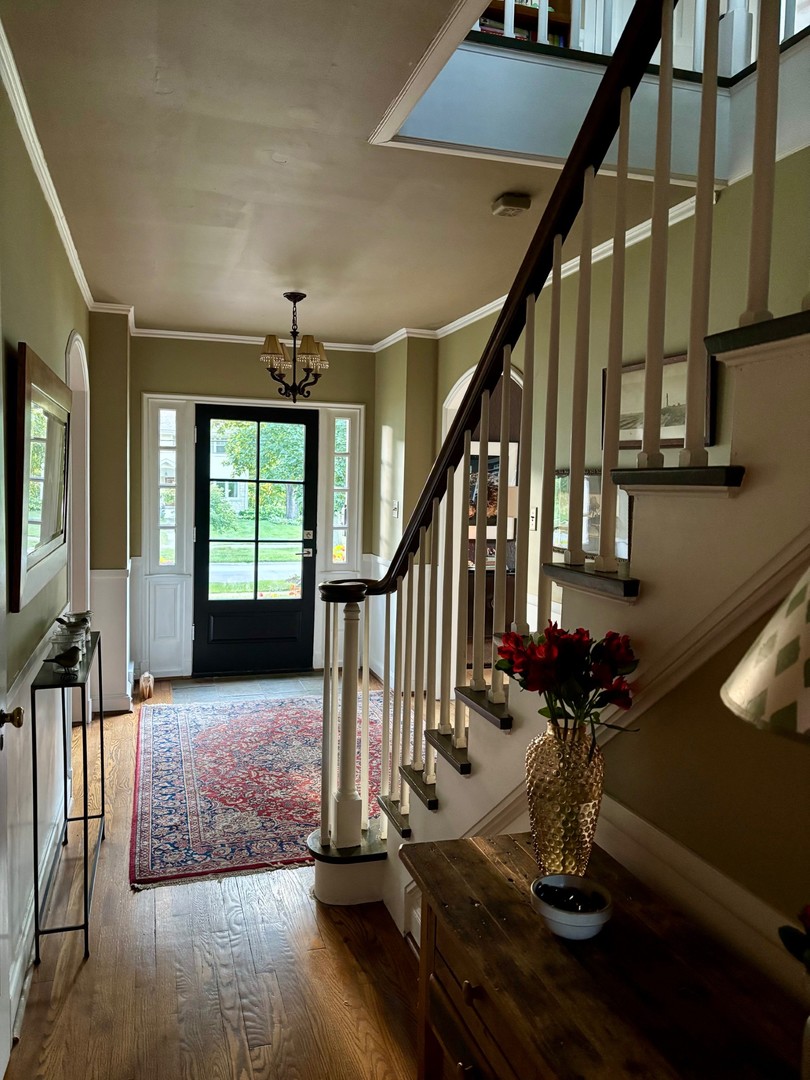 804 North Wheaton Avenue Wheaton, IL 60187 - Photo 2 of 7 a view of entryway and hall with wooden floor