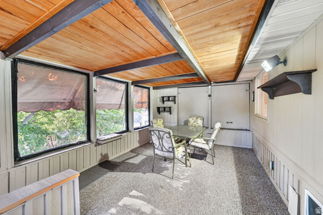 1464 990 West Provo, UT 84601 - Photo 34 of 41 Enclosed porch with a wood-plank ceiling, exposed beams, and a textured floor