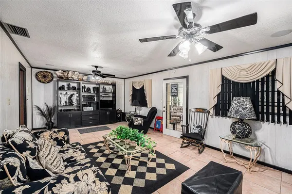 a spacious bedroom with two beds and large windows