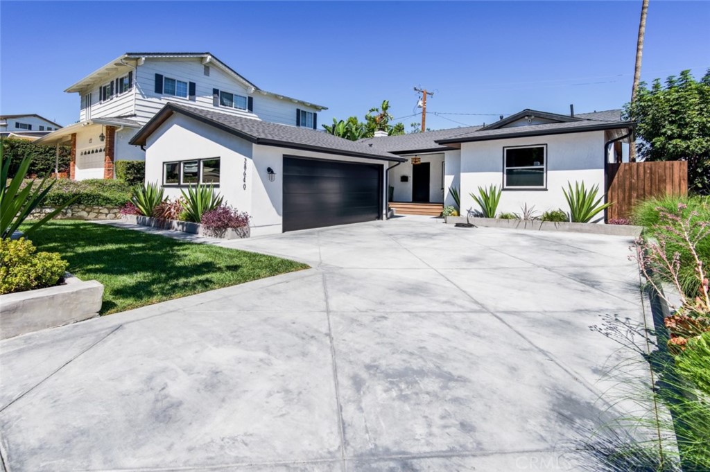 28640 Gunter Road Rancho Palos Verdes, CA 90275 - Photo 1 of 1 a front view of a house with a yard and garage