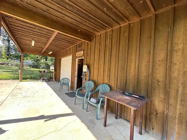 a patio with table and chairs