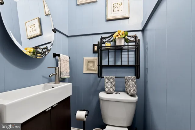 a bathroom with a bathtub sink and mirror