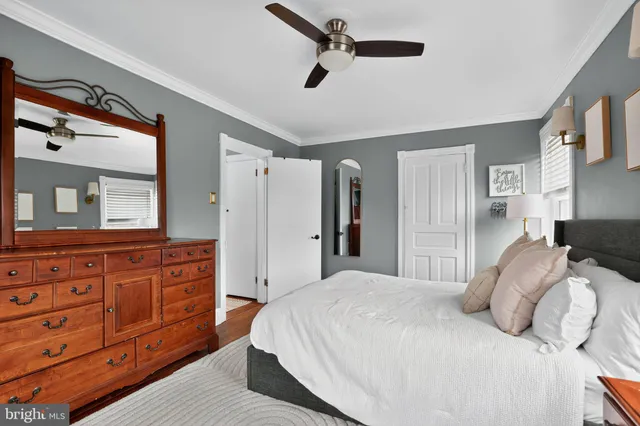 a bedroom with a large bed and a large closet