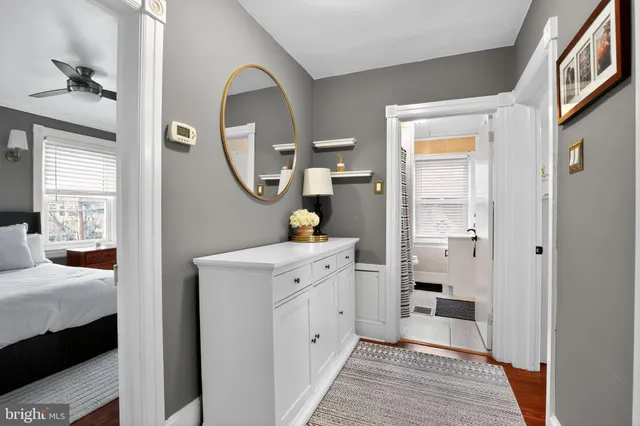 a spacious bathroom with a double vanity sink and a mirror
