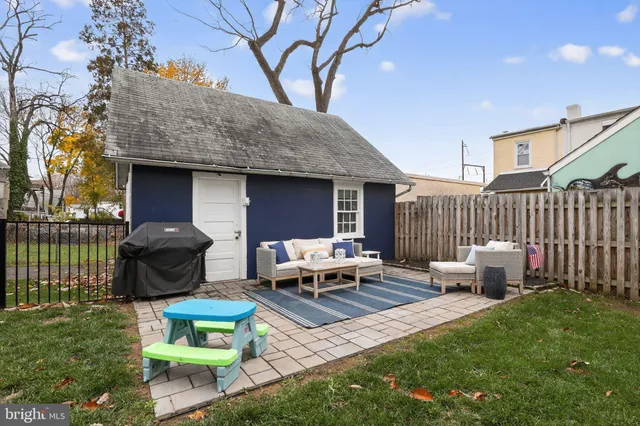 a view of a patio with couches chairs and a fire pit