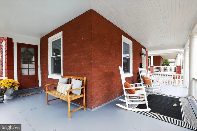 a backyard of a house with outdoor seating
